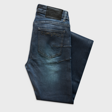 AMÉLIE SKINNY FLARED JEANS IN WAXED BLUE DENIM