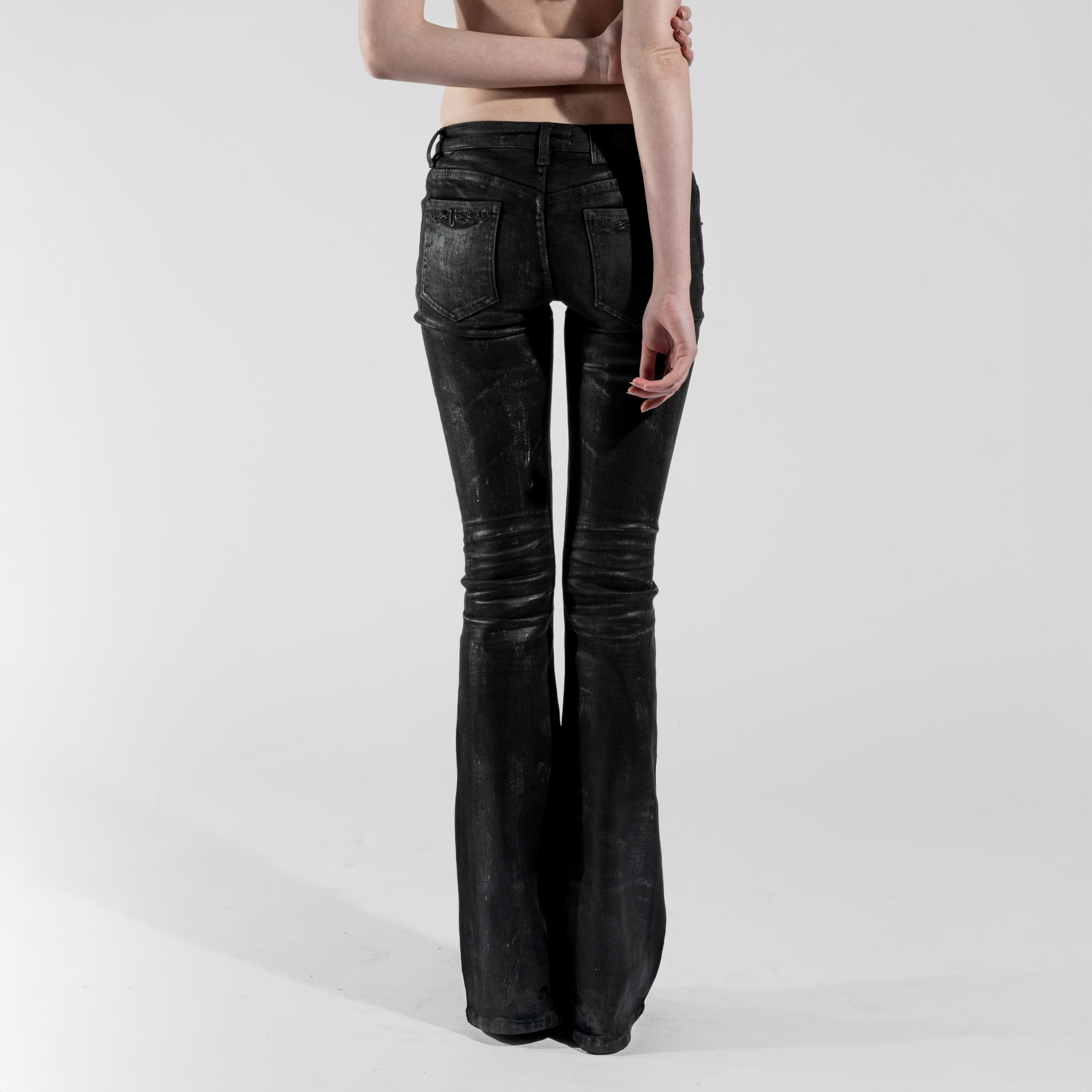 SKINNY FLARED JEANS IN WAXED BLACK DENIM